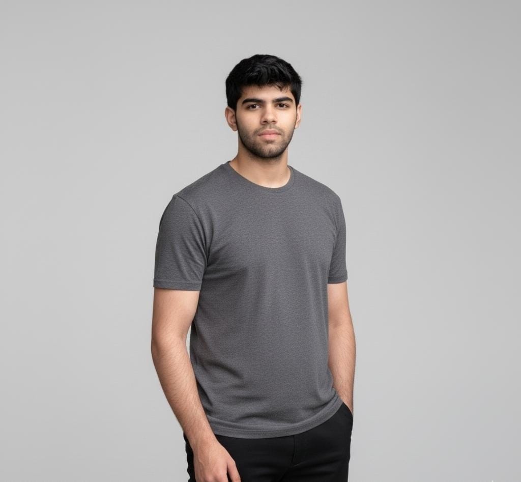 Man wearing a gray t-shirt against a plain background